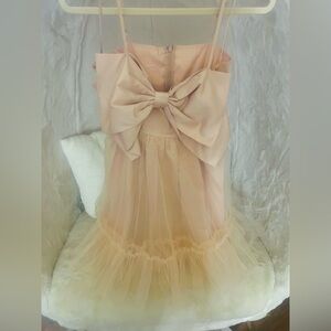 Elegant Peach Mini Dress with Bow